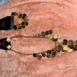 Gold necklace, earrings and bracelet